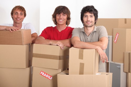 Commercial moving crew handling office desks and equipment