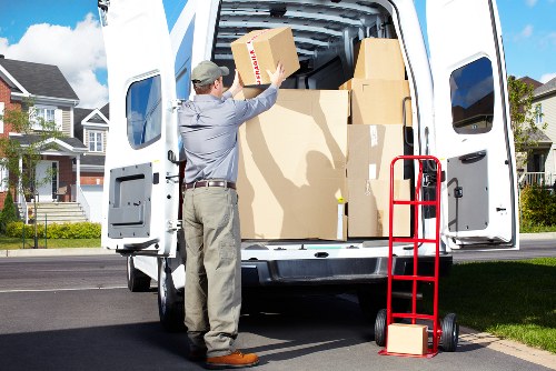 Local movers organizing boxes inside a moving van in Bellingham