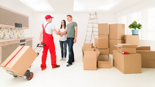 Loading furniture into a moving van during a removal service