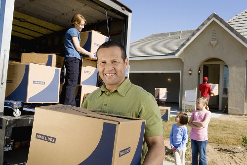 Packed boxes and furniture prepared for recycling and donation in Bellingham